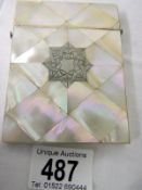 A Mother of Pearl card case (approx. 3 x 4" / 7.75 x 10.25cm)