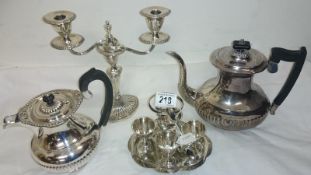 A silver plated teapot, coffepot, candel