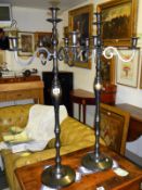 Pair of brass candelabras with patinated finish (approx. height 37 1/2" / 95 cm)