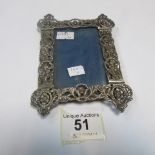 A silver cherub pattern photo frame, HM London 1888/89
 
Condition
Fair to good condition with no