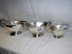 Three silver Art Deco gravy boats