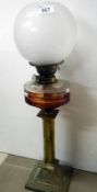 Victorian oil lamp with brass column base, glass vessel and opaque glass shade with Duplex