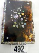 A Faux tortoise shell card case with Mother of Pearl inlay (approx. 2 3/4 x 4 1/4" / 7 x 11cm) -