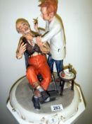 A signed Capodimonte figural group The Barber
 
Condition
Good condition with no cracks or damage