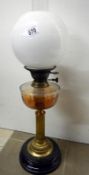 Victorian oil lamp with brass corinthian column, glass vessel, and opaque globe shade (approx.