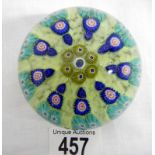 A Murano millefiori glass paperweight (approx. diameter 3" / 7.75cm)
 
Condition
Some scratches &