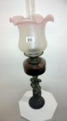 A Victorian spelter figurine oil lamp wi