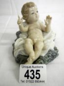 A Lladro baby in crib figure (approx. height 3 1/4" / 8.25cm)
