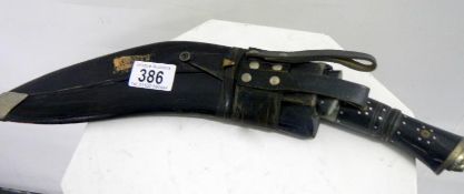 A Kukri with sheath and skinning knives