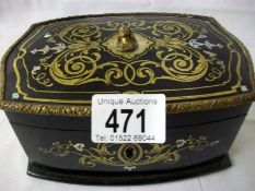 A Lacquered jewellery box with brass and Mother of Pearl inlay (approx. length 6 3/4" / 17cm)