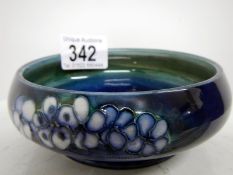 A Moorcroft dish with small floral pattern on blue ground,4", circa 1936, impressed Moorcroft marks,