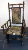 A Victorian childs rocking chair with ta