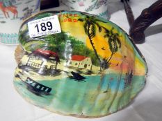 A large nut painted with tropical scene
