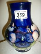 A Moorcroft pansy vase on blue ground,7"