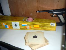 A 1950s tinplate Sports Trainer Mystery Shooting Gallery with score cards
 
Condition
Firing