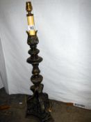 A large ornate pricket lamp base