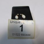 A pair of 9ct gold drop opal earrings