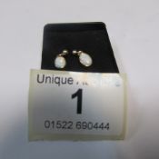 A pair of 9ct gold drop opal earrings