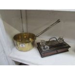 A 19th century brass saucepan and a 2 bo