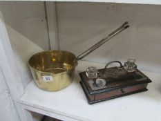 A 19th century brass saucepan and a 2 bo