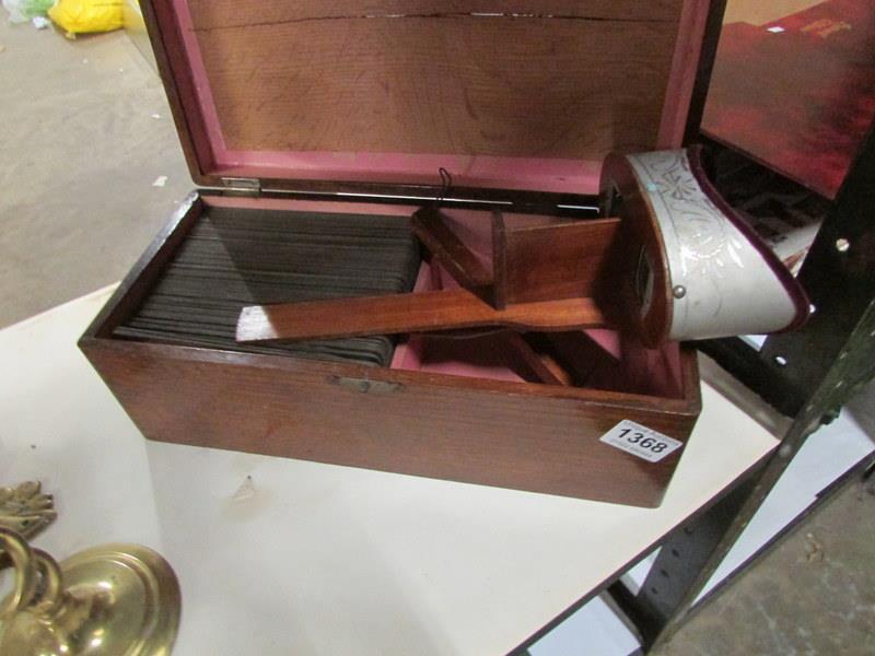 A stereoscope viewer with 97 cards by M E Wright in wooden box