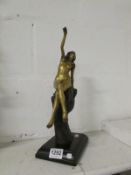 A 20th century bronze of a nude lady on hand