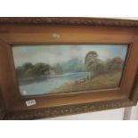 A framed and glazed watercolour lake sce