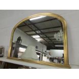 A gilt framed overmantel mirror