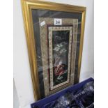 An embroidered silk panel, framed and gl