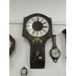 A large black Parliament clock with key (no hands)