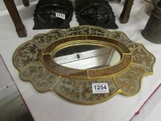 A decorated oval mirror
