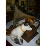 An HMV dog figure, an HMV sign and a horn gramaphone