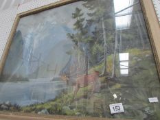 A framed mountain lake scene with stag