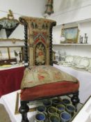 A Victorian nursing chair with tapestry seat and back