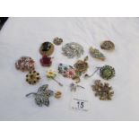 A mixed lot of costume brooches