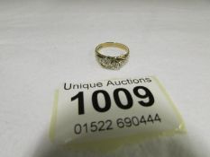 A yellow gold cross over 2 diamond ring marked 375, size J