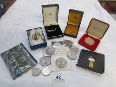 A mixed lot of coins and silver necklaces