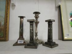 A pair of silver plated candlesticks and