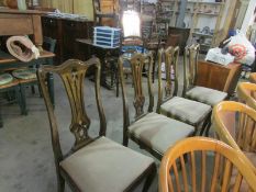 A set of 4 high backed dining chairs