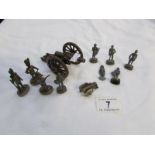 A quantity of toy soldiers and cannon