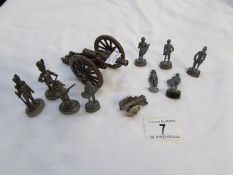 A quantity of toy soldiers and cannon