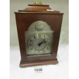 A mahogany bracket clock with silvered dial