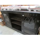 An oak leaded glazed bookcase