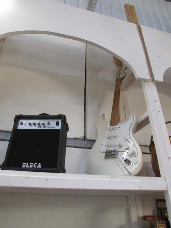 An electric guitar and amplifier