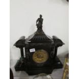 A large black slate mantel clock surmounted figures