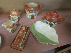 A cottage teapot, milk jug, sugar bowl,