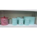 A set of storage tins and 2 others