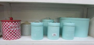 A set of storage tins and 2 others