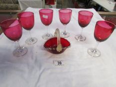 6 cranberry glass wine glasses and a red