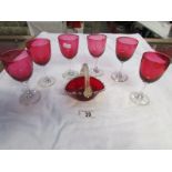 6 cranberry glass wine glasses and a red